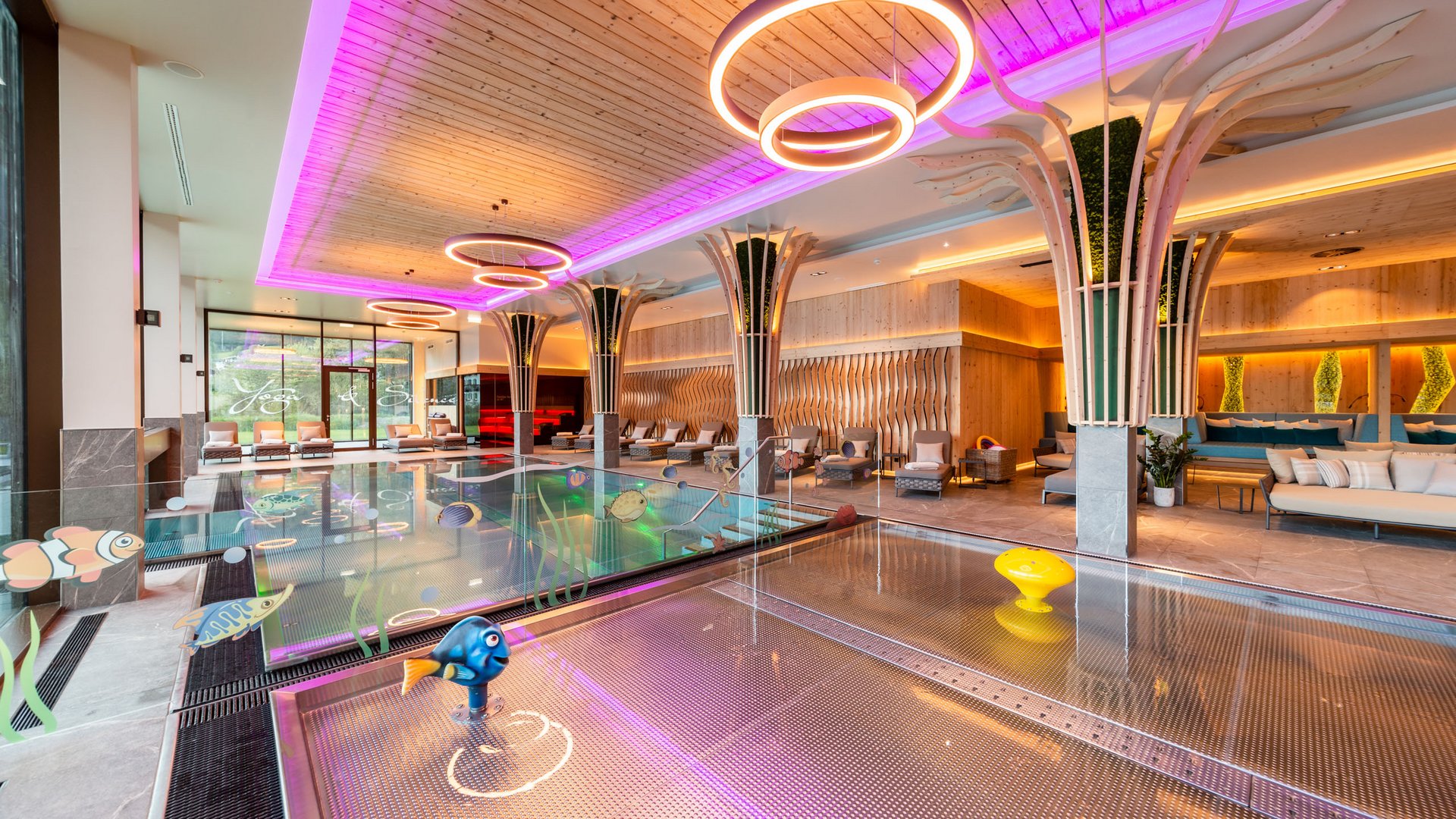 Holidays at the Postwirt: more than just in “a” hotel in Soll. Indoor pool area with kids pool, seating, and modern lighting
