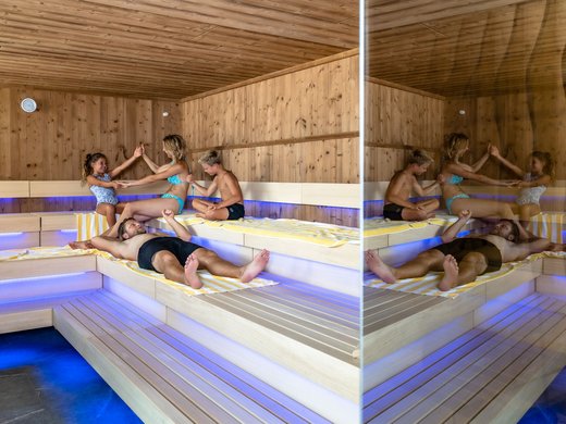 Wellness and spa hotel in Soll Family with two children relaxing together in a wooden sauna with blue lighting